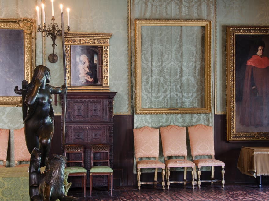 An empty gilt frame on the wall of the Isabella Stewart Gardner Museum, where a stolen Rembrandt used to hang.