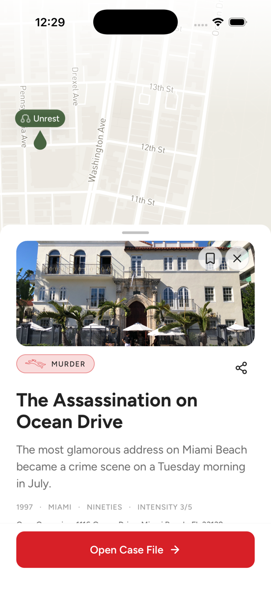 The Psychopedia map at street level on Ocean Drive, Miami Beach, with a case card open: cover photograph, category, title and quick facts.